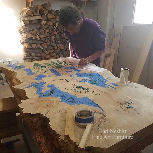 Earl places turquoise in voids of custom maple burl cluster slab